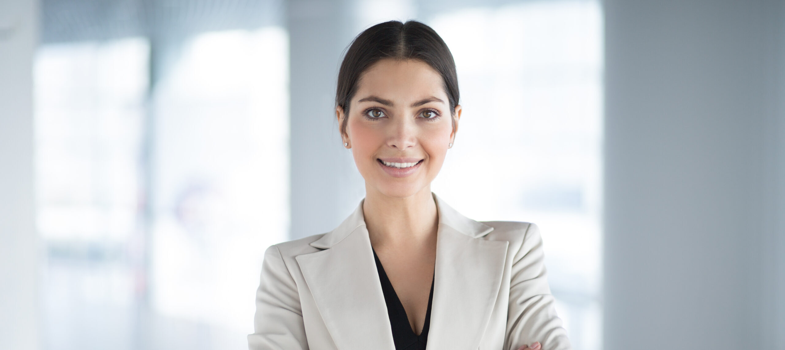 Confident Pretty Business Woman With Arms Crossed